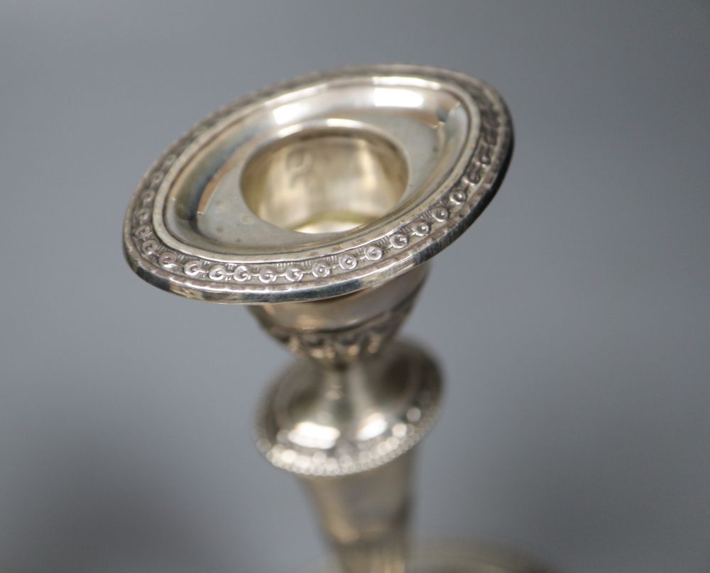 A pair of late Victorian silver oval candlesticks, Thomas Bradbury & Sons, London, 1896, weighted, 18.9cm.